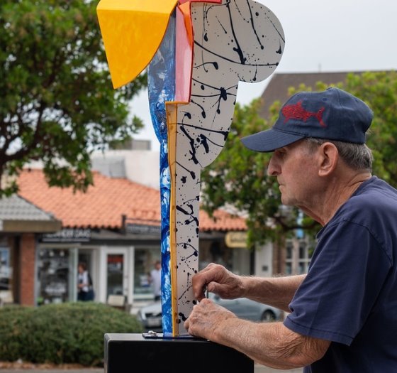 artist installs sculpture