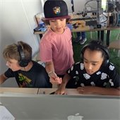 kids huddled around computer monitor