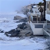 high tide hits seawall