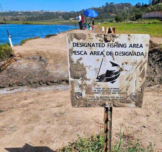People fishing in San Dieguito wetlands