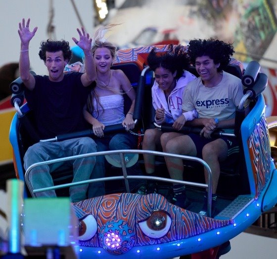 fairgoers on ride