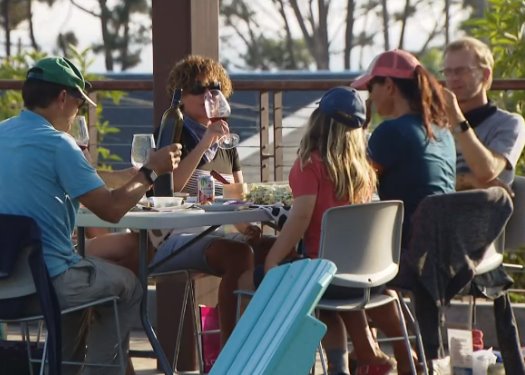family dines on the deck