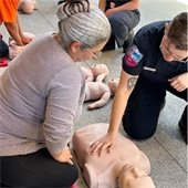 woman practices CPR