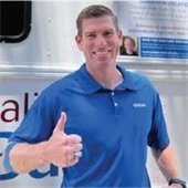 man gives thumbs up at blood drive