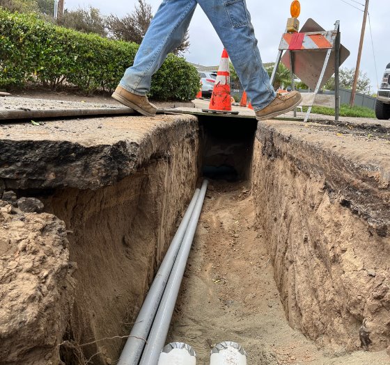 worker, trench and coduit