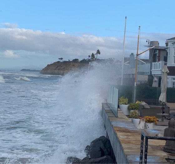 surf crashing into seawall