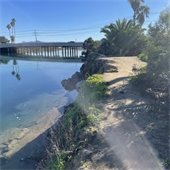 south riverbank near public works