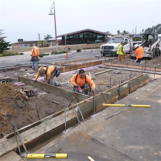 forming curbs for crosswalk at 10th Streeet