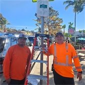 public works installs "Free Parking" sign covering