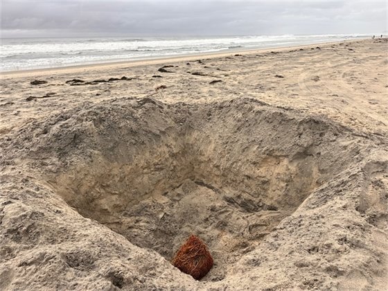deep hole in the sand