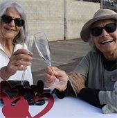 ladies clink champagne glasses