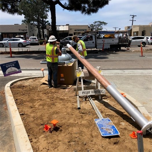 Electricians assemble a streetlight